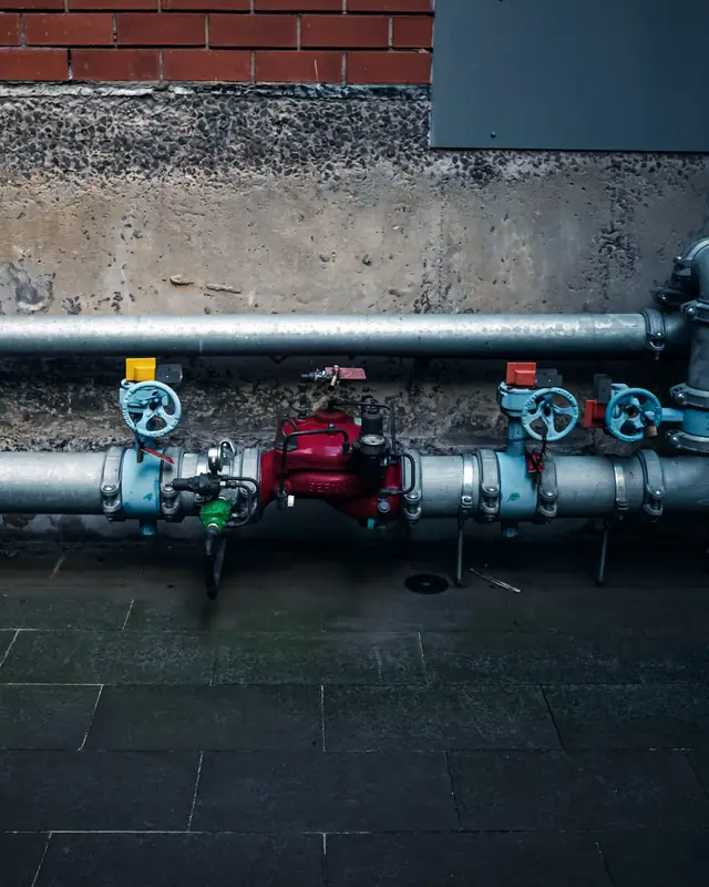 Gas meter and service piping on the exterior wall of a North Shore home