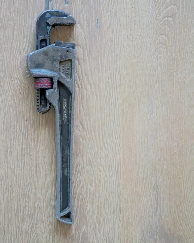 Service technician's tool roll laid out on site before a maintenance visit