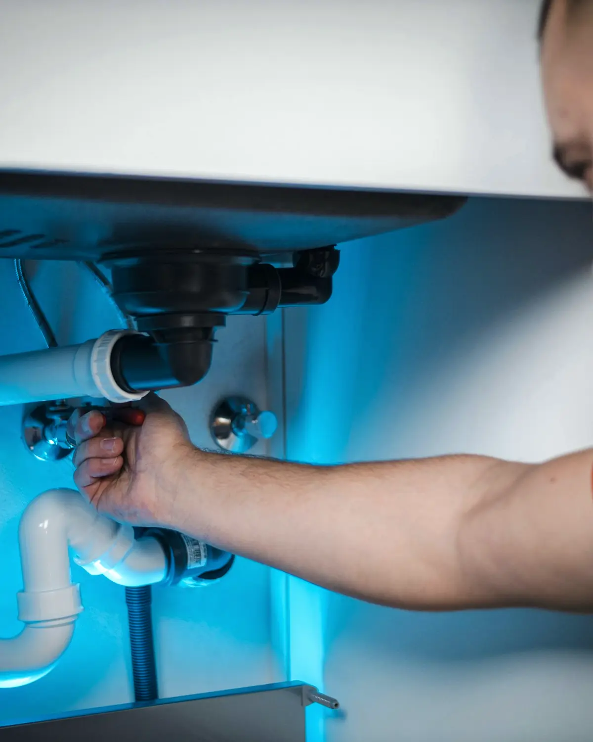 North Wave plumber fitting new supply pipework during a scheduled service call
